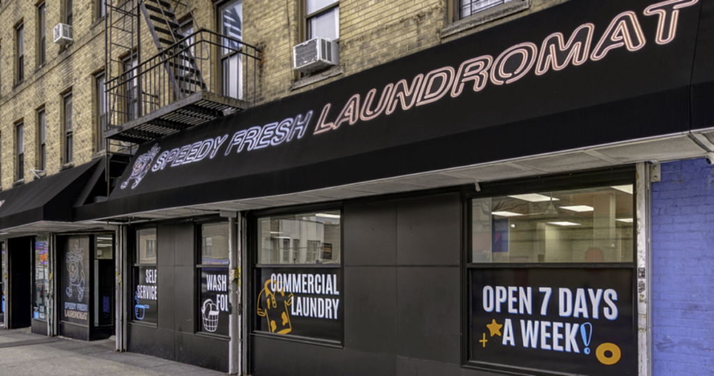 Speedy Fresh Laundromat storefront, attracting customers with its appealing design and efficient laundry services.